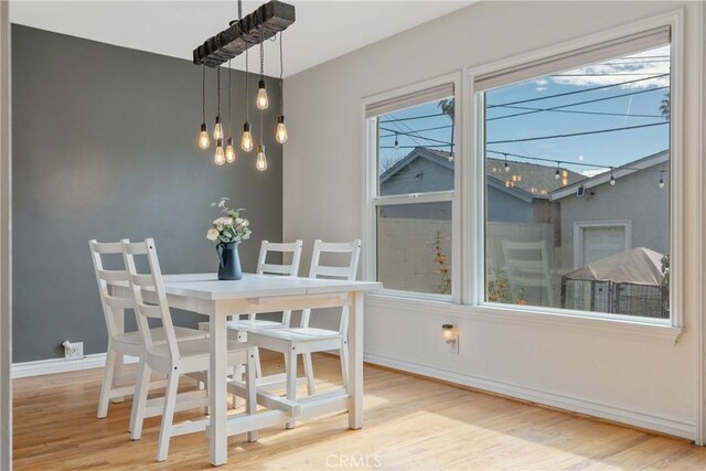 14844 Lull St, Van Nuys, CA 91405 - dining space featuring wood finished floors and a chandelier