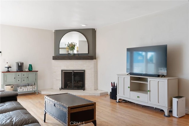14844 Lull St, Van Nuys, CA 91405 - living area with wood finished floors, a brick fireplace, and recessed lighting