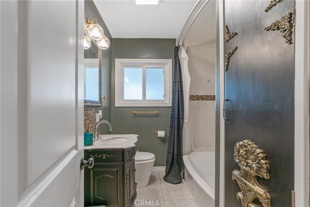 14844 Lull St, Van Nuys, CA 91405 - bathroom featuring baseboards, shower / bath combination with curtain, toilet, vanity, and tile patterned floors
