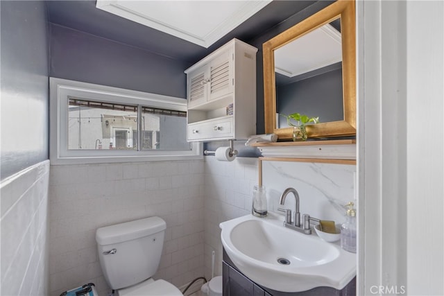 14844 Lull St, Van Nuys, CA 91405 - bathroom featuring vanity, tile walls, plenty of natural light, and ornamental molding