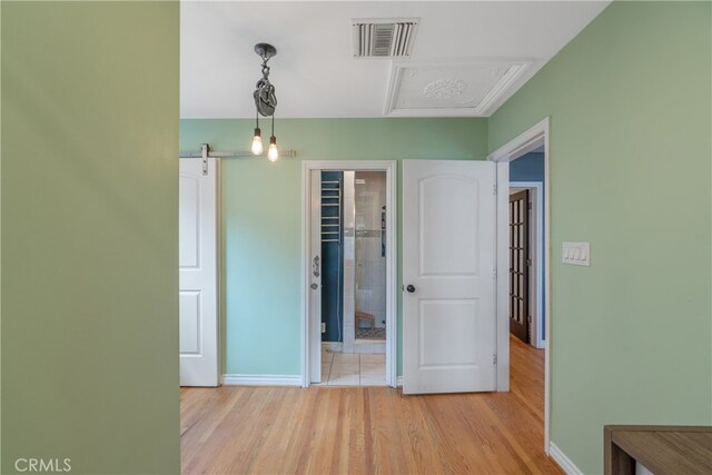 14844 Lull St, Van Nuys, CA 91405 - interior space featuring visible vents, baseboards, light wood-type flooring, and attic access