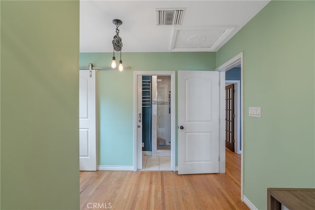 14844 Lull St, Van Nuys, CA 91405 - unfurnished bedroom featuring light wood-style floors, attic access, and a walk in closet