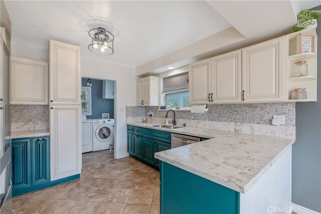 14844 Lull St, Van Nuys, CA 91405 - kitchen featuring open shelves, washer and clothes dryer, a healthy amount of sunlight, decorative backsplash, and a sink