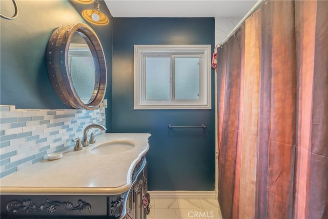 14844 Lull St, Van Nuys, CA 91405 - bathroom featuring decorative backsplash, vanity, and baseboards