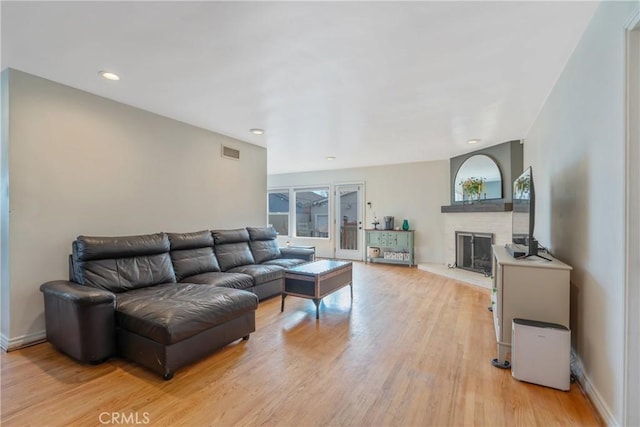 14844 Lull St, Van Nuys, CA 91405 - living room featuring visible vents, baseboards, light wood-type flooring, a fireplace, and recessed lighting