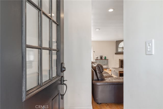 14844 Lull St, Van Nuys, CA 91405 - foyer with wood finished floors, recessed lighting, and a fireplace