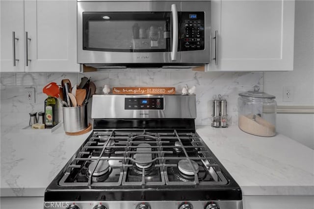 9876 Arrow Unit 1, Rancho Cucamonga, CA 91730 - kitchen view of appliances with stainless steel finishes, white cabinets, and backsplash