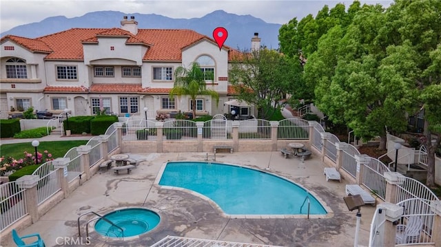 9876 Arrow Unit 1, Rancho Cucamonga, CA 91730 - community pool featuring a mountain view, a hot tub, and a patio area