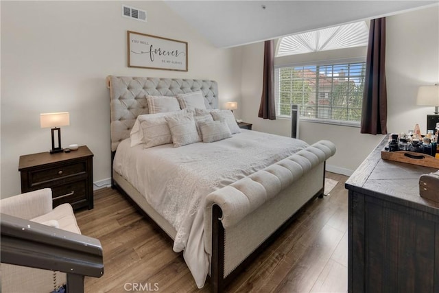 9876 Arrow Unit 1, Rancho Cucamonga, CA 91730 - bedroom with wood finished floors, vaulted ceiling, and baseboards
