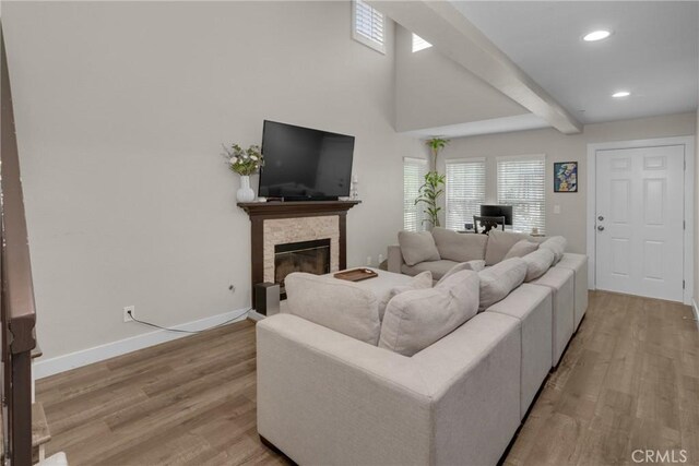 9876 Arrow Unit 1, Rancho Cucamonga, CA 91730 - living room with wood finished floors, recessed lighting, baseboards, a fireplace, and beamed ceiling