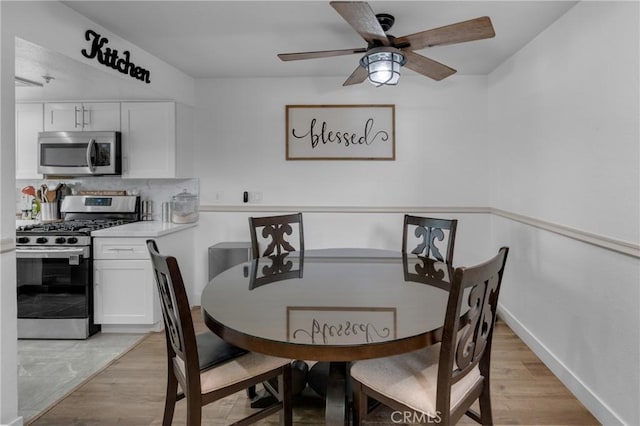 9876 Arrow Unit 1, Rancho Cucamonga, CA 91730 - dining area featuring light wood-style floors, a ceiling fan, and baseboards