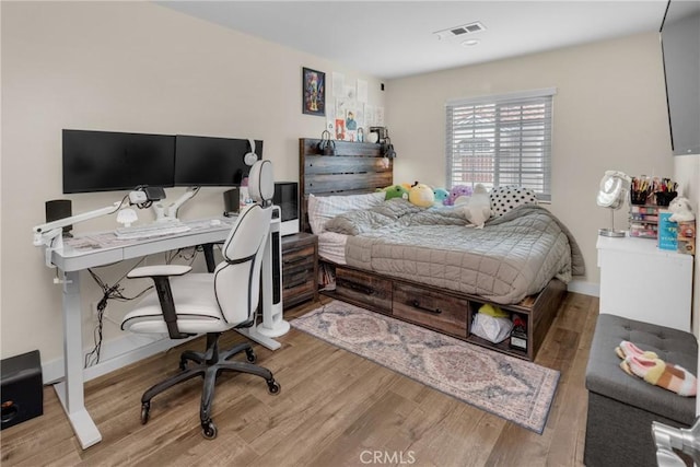 9876 Arrow Unit 1, Rancho Cucamonga, CA 91730 - bedroom with wood finished floors, a desk, and baseboards