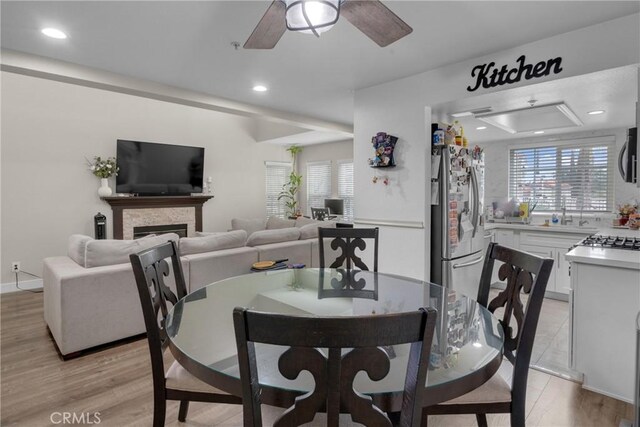 9876 Arrow Unit 1, Rancho Cucamonga, CA 91730 - dining area with recessed lighting, ceiling fan, a fireplace, and light wood finished floors