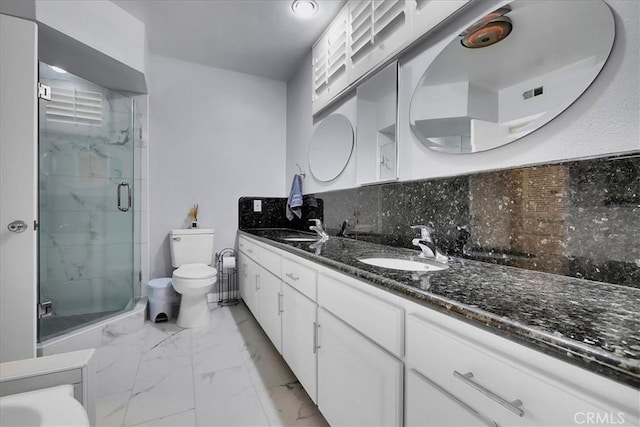 full bath featuring tasteful backsplash, toilet, marble finish floor, a sink, and a stall shower