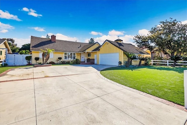 ranch-style home with driveway, a garage, fence, and a front lawn