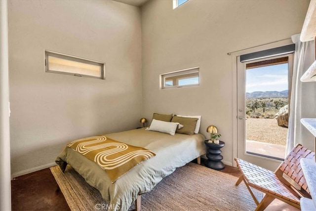 53105 Chia Trl, Pioneertown, CA 92268 - bedroom with access to outside, baseboards, and a mountain view