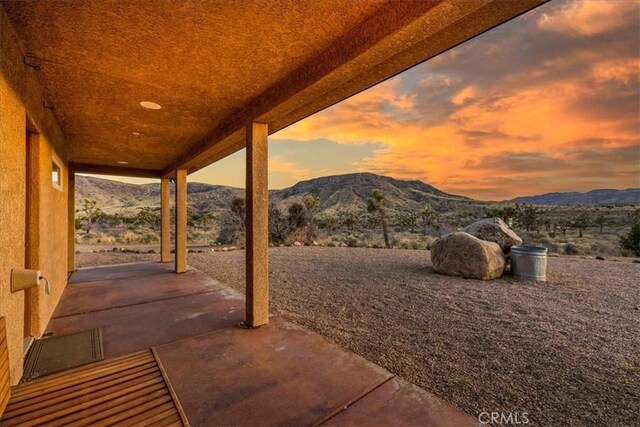 53105 Chia Trl, Pioneertown, CA 92268 - patio terrace at dusk featuring a mountain view