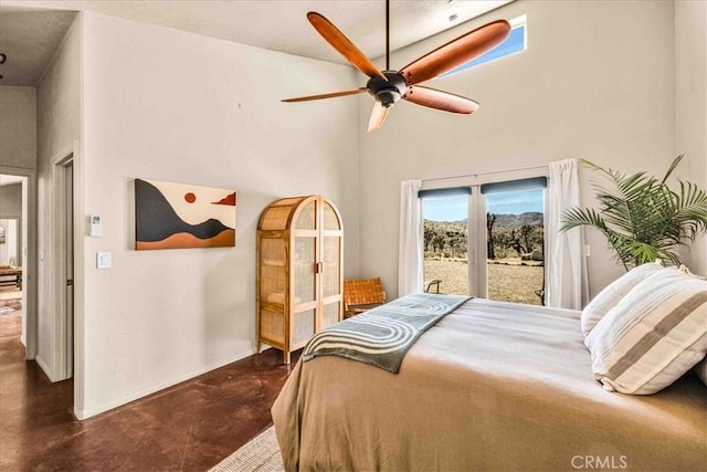 53105 Chia Trl, Pioneertown, CA 92268 - bedroom with access to outside, a high ceiling, baseboards, and finished concrete flooring