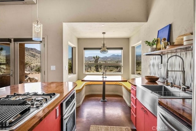 53105 Chia Trl, Pioneertown, CA 92268 - kitchen featuring open shelves, a sink, appliances with stainless steel finishes, wood counters, and finished concrete flooring