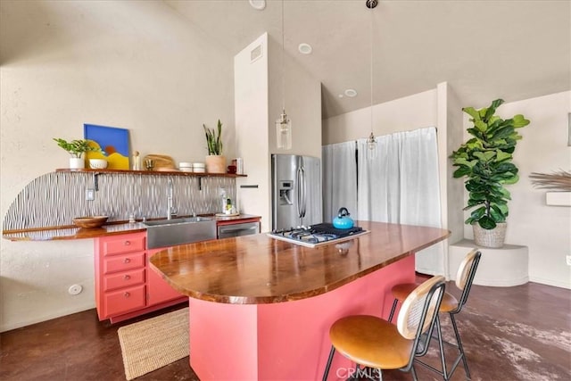 53105 Chia Trl, Pioneertown, CA 92268 - kitchen featuring high vaulted ceiling, concrete flooring, a kitchen island, a sink, and stainless steel appliances