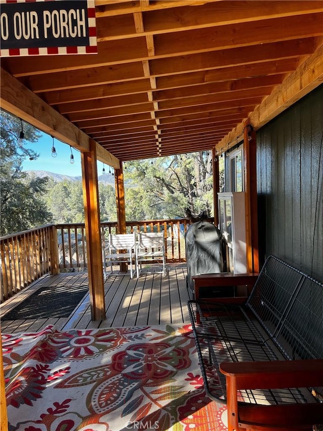 wooden terrace featuring a mountain view