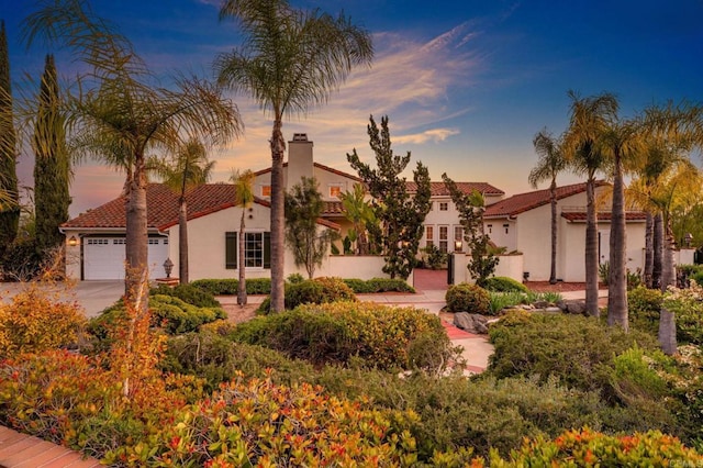 4033 Keri Way, Fallbrook, CA 92028 - mediterranean / spanish-style house featuring stucco siding, a tiled roof, a chimney, and driveway