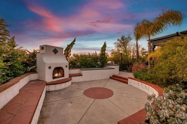4033 Keri Way, Fallbrook, CA 92028 - patio terrace at dusk featuring a lit fireplace