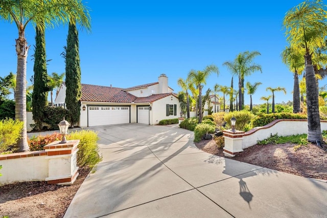 4033 Keri Way, Fallbrook, CA 92028 - mediterranean / spanish home with a garage, driveway, a chimney, a tile roof, and stucco siding