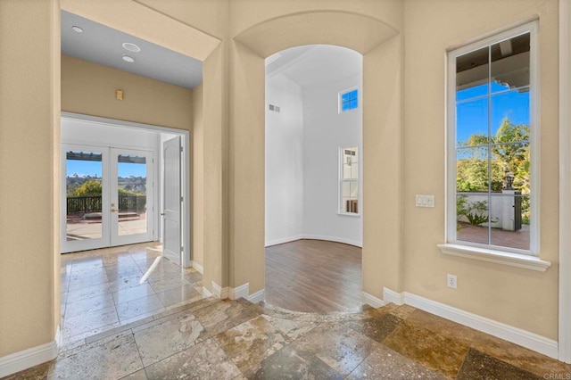 4033 Keri Way, Fallbrook, CA 92028 - foyer entrance featuring stone tile flooring, baseboards, arched walkways, and french doors