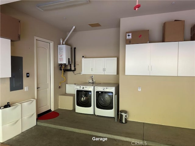 washroom with cabinet space, water heater, electric panel, and washer and clothes dryer