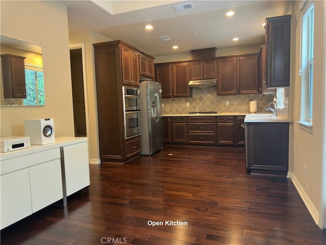 kitchen with visible vents, dark wood-style flooring, appliances with stainless steel finishes, and light countertops