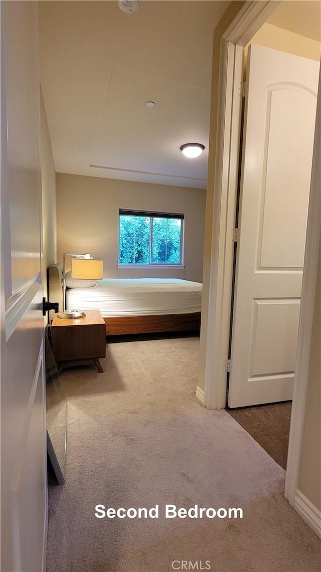 carpeted bedroom with baseboards