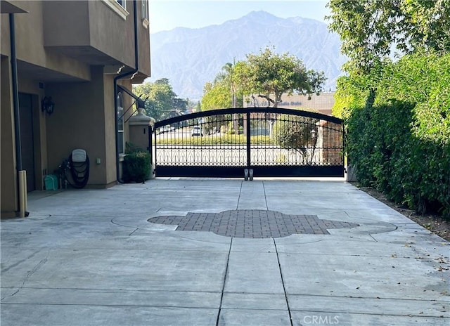 view of gate with a mountain view