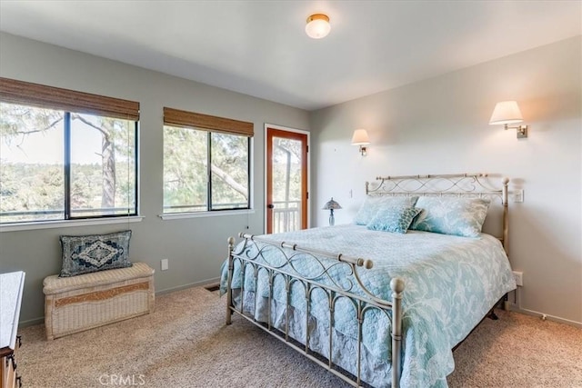carpeted bedroom featuring baseboards