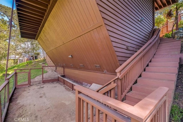 exterior space with stairway and a patio