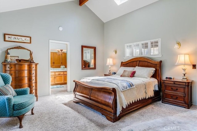 bedroom featuring high vaulted ceiling, light colored carpet, beamed ceiling, and connected bathroom