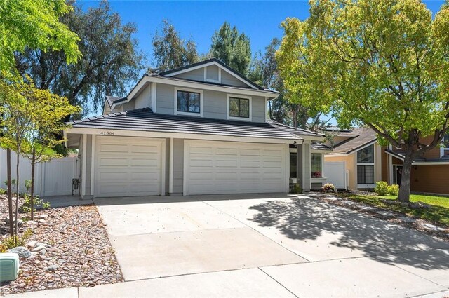 41564 Big Sage Ct, Temecula, CA 92591 - view of front of home featuring a garage, concrete driveway, and a tile roof