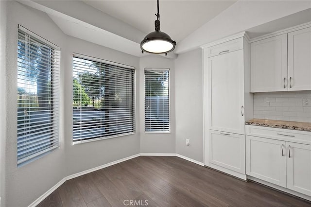 41564 Big Sage Ct, Temecula, CA 92591 - unfurnished dining area with baseboards, dark wood-style flooring, and vaulted ceiling