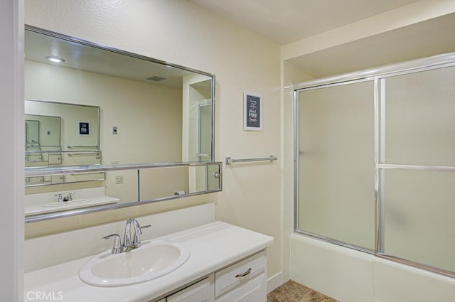 523 Calle Aragon Unit C, Laguna Woods, CA 92637 - full bathroom with shower / bath combination with glass door and vanity