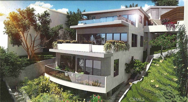 410 Alta Vista Ave, Laguna Beach, CA 92651 - rear view of property with stucco siding and a balcony