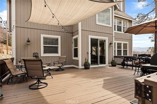 wooden deck featuring outdoor dining space