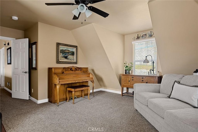 sitting room with baseboards, a ceiling fan, and carpet