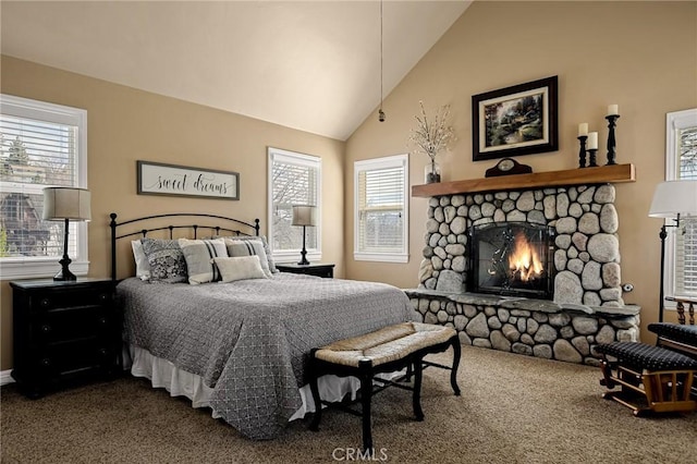 bedroom with dark carpet, high vaulted ceiling, and a fireplace