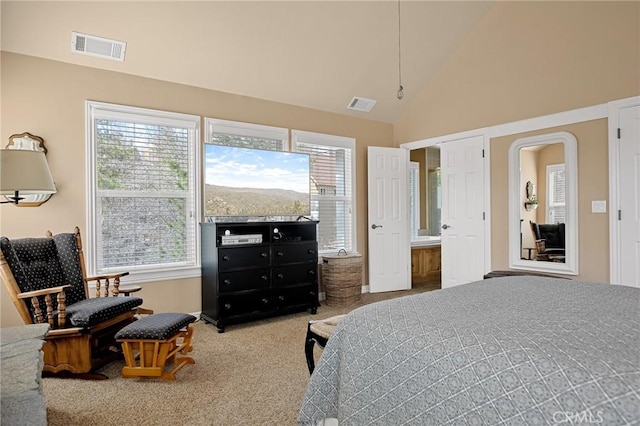 bedroom with carpet, visible vents, and multiple windows