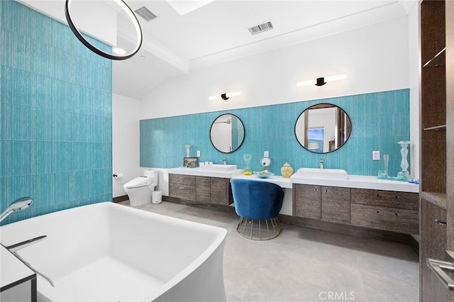 15877 Esquilime Dr, Chino Hills, CA 91709 - full bath with tile walls, a freestanding tub, vanity, concrete flooring, and toilet