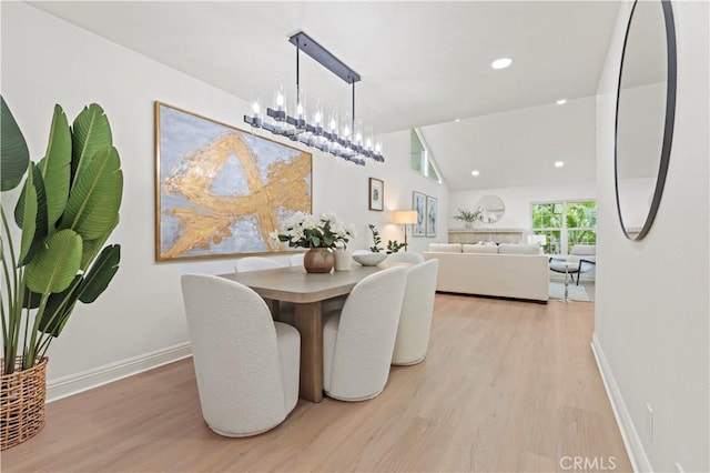 49 W Yale Loop Unit 26, Irvine, CA 92604 - dining area featuring light wood-style floors, baseboards, a chandelier, recessed lighting, and vaulted ceiling