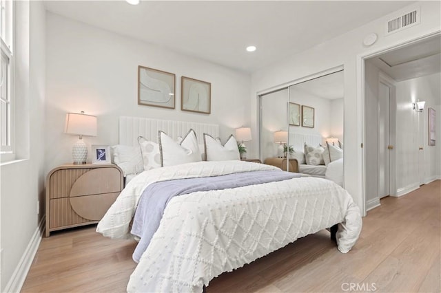 49 W Yale Loop Unit 26, Irvine, CA 92604 - bedroom featuring light wood-type flooring, baseboards, recessed lighting, and a closet