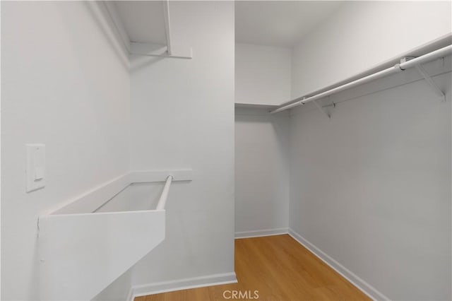 49 W Yale Loop Unit 26, Irvine, CA 92604 - spacious closet featuring light wood finished floors