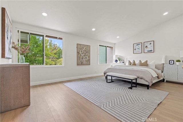 49 W Yale Loop Unit 26, Irvine, CA 92604 - bedroom with wood finished floors, recessed lighting, baseboards, and lofted ceiling