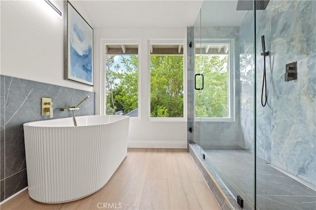 49 W Yale Loop Unit 26, Irvine, CA 92604 - full bath featuring a shower stall, a freestanding tub, tile walls, and wood finished floors